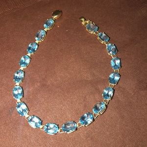Blue topaz tennis bracelet 14kt yellow gold